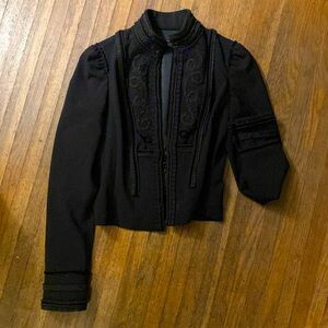 Vintage Shakespearean style jacket with hook closures.